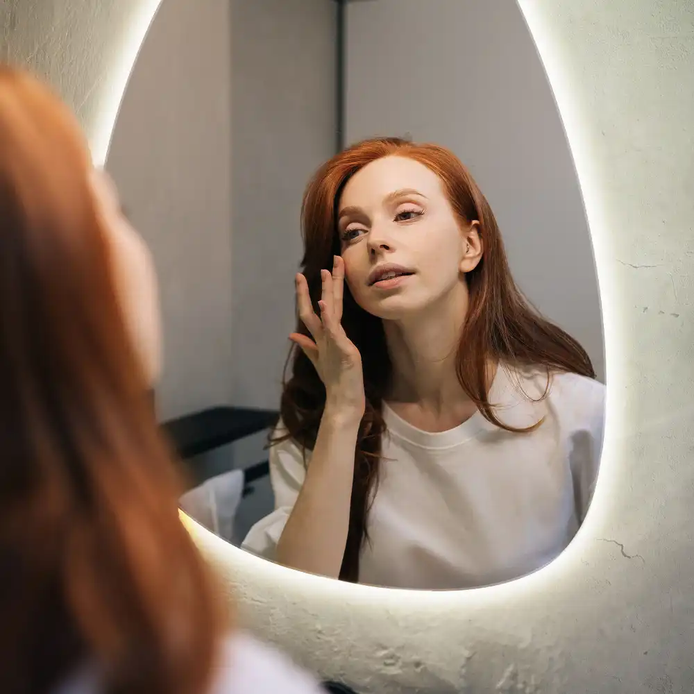Asymmetrical egg mirror with LED backlight wall mounted