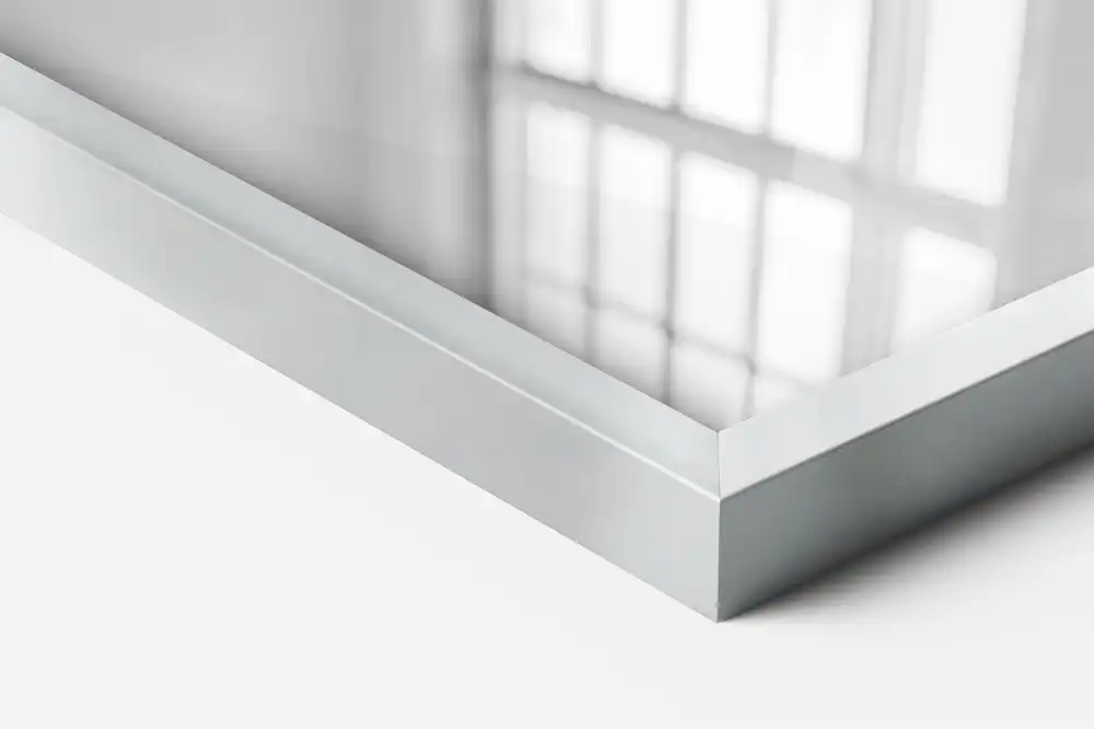 Rectangular wall mounted mirror with a silver frame