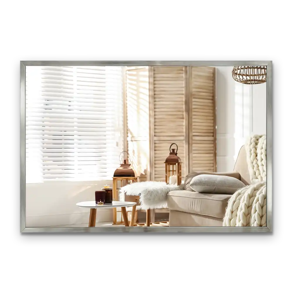 Rectangular wall mounted mirror with a silver frame