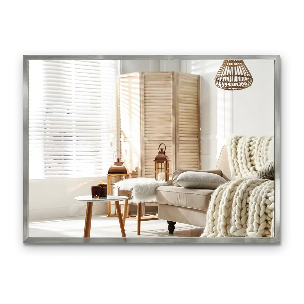 Rectangular wall mounted mirror with a silver frame