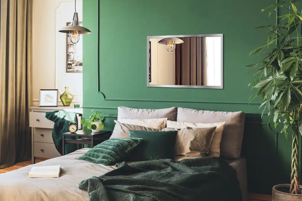Rectangular wall mounted mirror with a silver frame