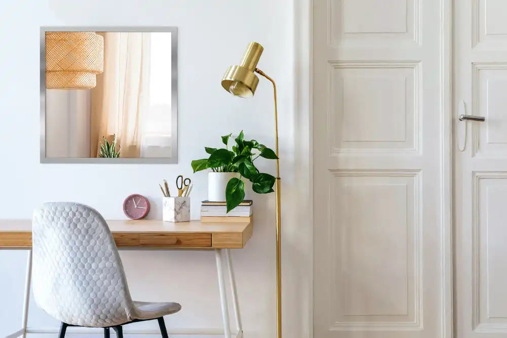 Rectangular wall mounted mirror with a silver frame