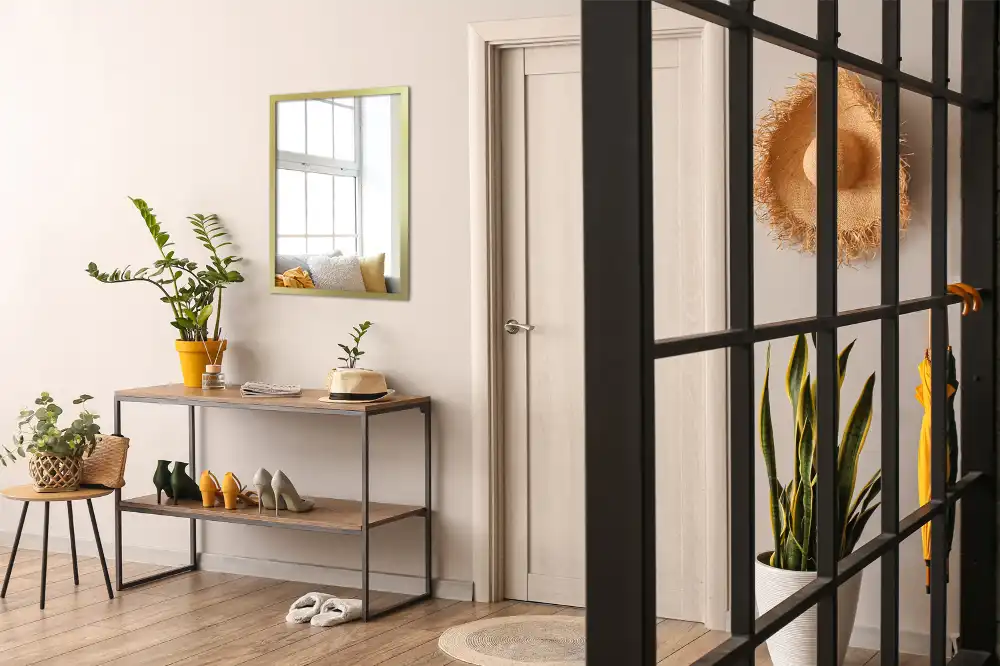 Rectangular hanging mirror with a gold frame