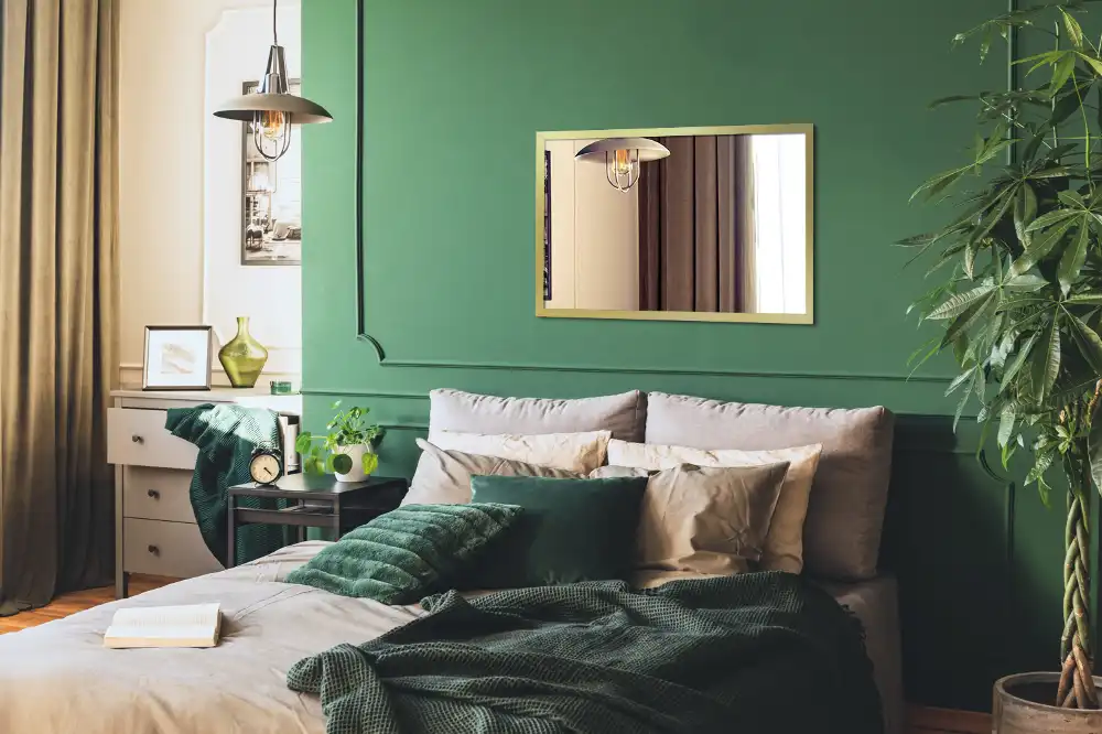 Rectangular hanging mirror with a gold frame