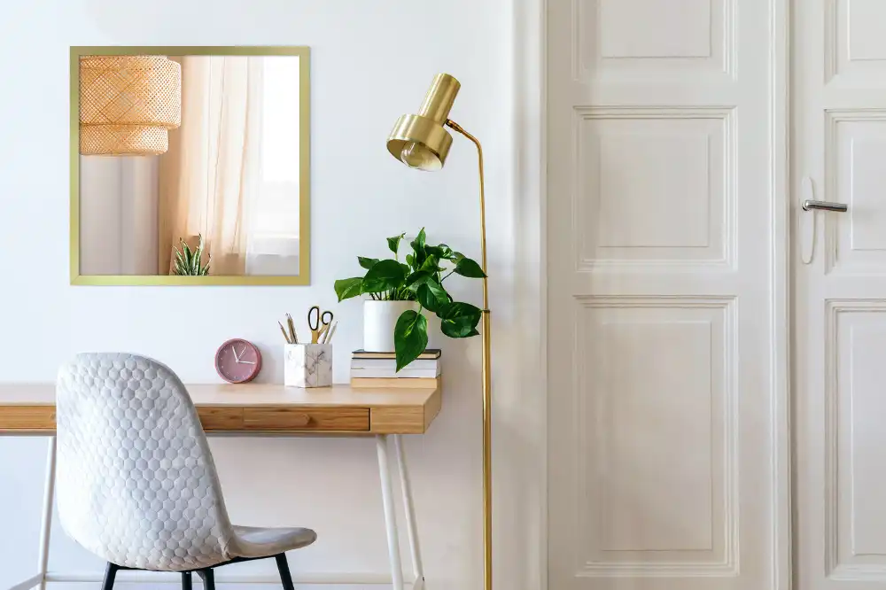 Rectangular hanging mirror with a gold frame