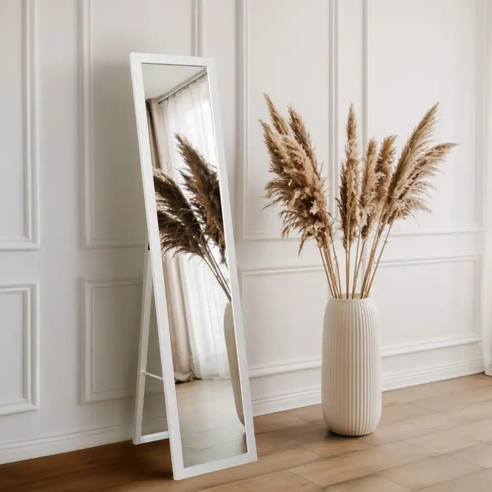 Standing mirror in a white frame