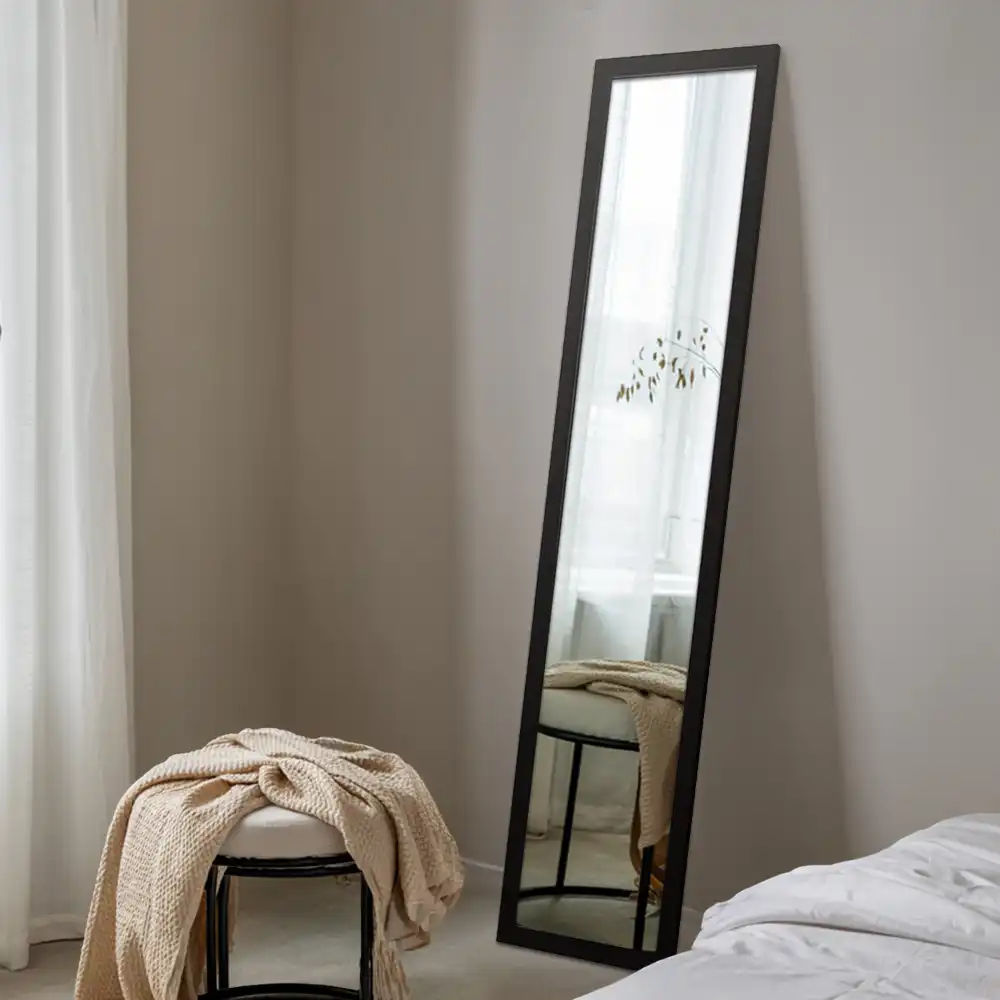 Standing mirror in a black frame